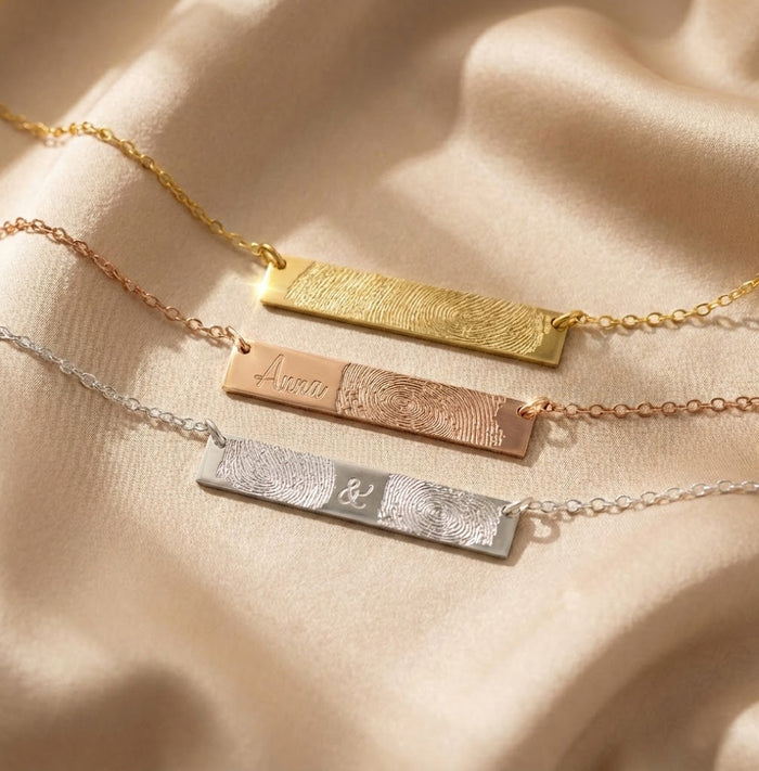 3 engraved fingerprint necklaces against a white background. Personalized minimalist bar necklace Custom engraved bar pendant Minimalist nameplate necklace Custom name bar necklace Engraved horizontal bar necklace Personalized name bar pendant Minimalist engraved necklace Customizable bar pendant jewelry Engraved bar necklace for women Custom coordinates bar necklace Minimalist bar pendant with engraving Personalized message bar necklace