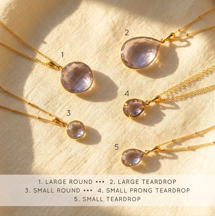 Alexandrite necklace size chart showing small and large round and teardrop pendant options.