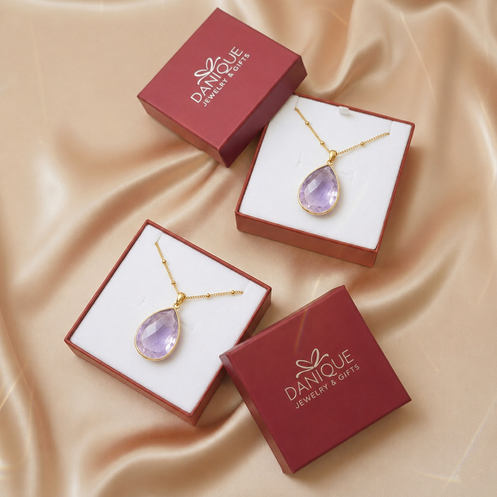 Alexandrite necklace displayed in Danique Jewelry gift box with burgundy packaging.