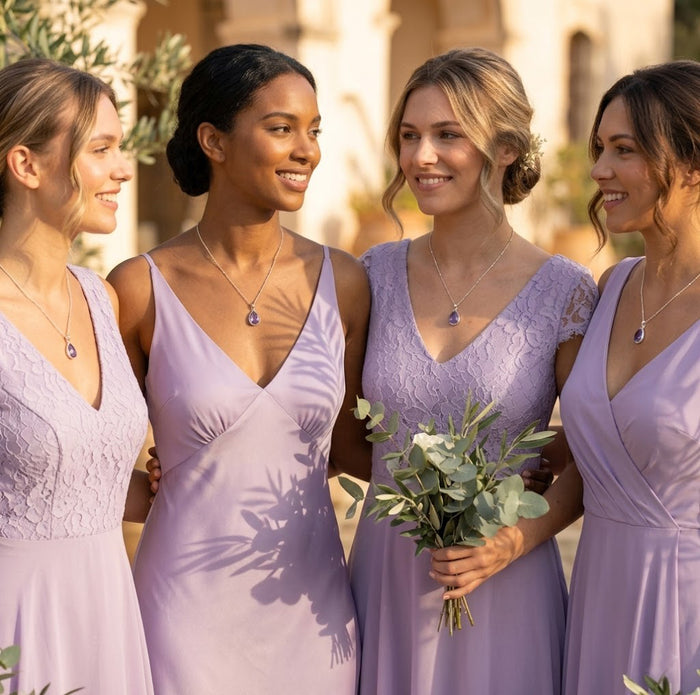 Bridesmaids wearing matching amethyst necklaces, purple gemstone bridal jewelry, elegant wedding party gift idea