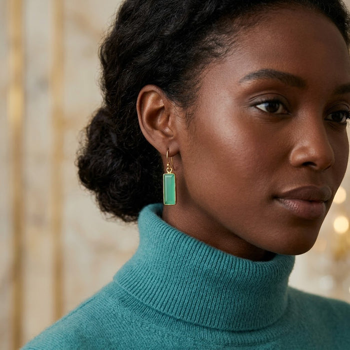 Model wearing aqua chalcedony bar drop earrings with a minimalist blue-green gemstone design.