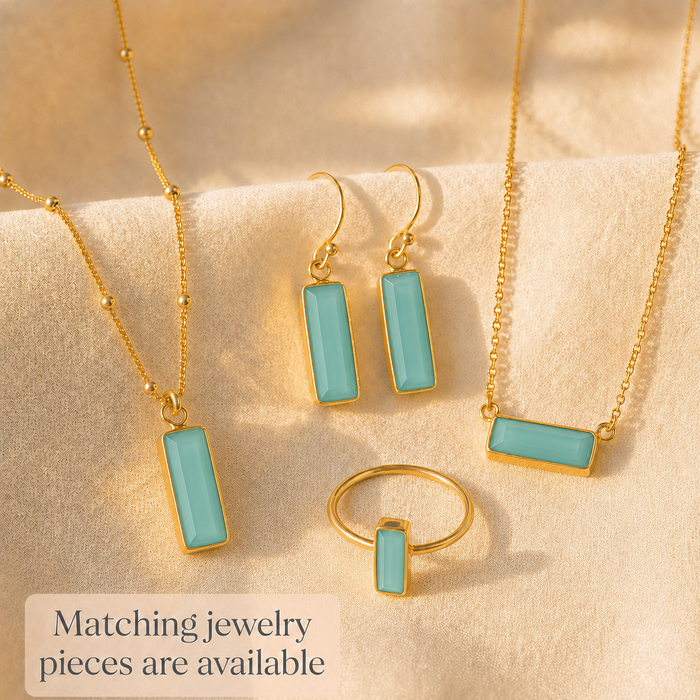 Matching aqua chalcedony jewelry pieces with bar earrings, necklace, bracelet, and ring.