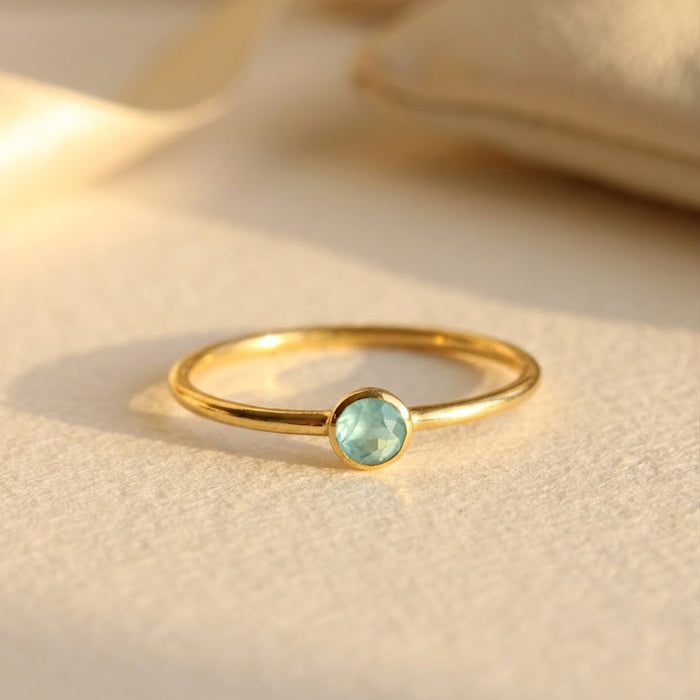 Single gold plated dainty 3mm aqua chalcedony gemstone ring. march  birthstone. On white background. 925 sterling silver, birthstone ring, stacking ring, stackable, birthstone jewelry, facet gemstone
