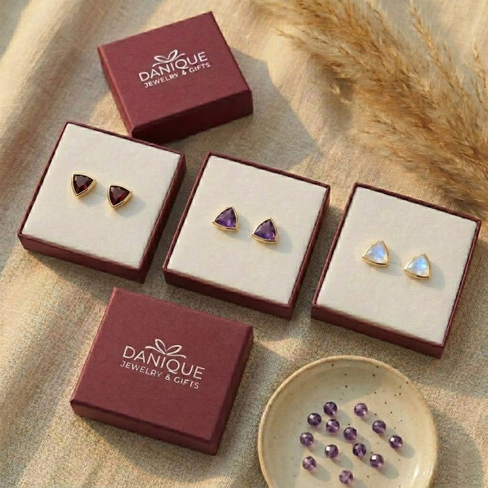 Labradorite triangle stud earrings displayed in Danique Jewelry gift boxes, ready for gifting.