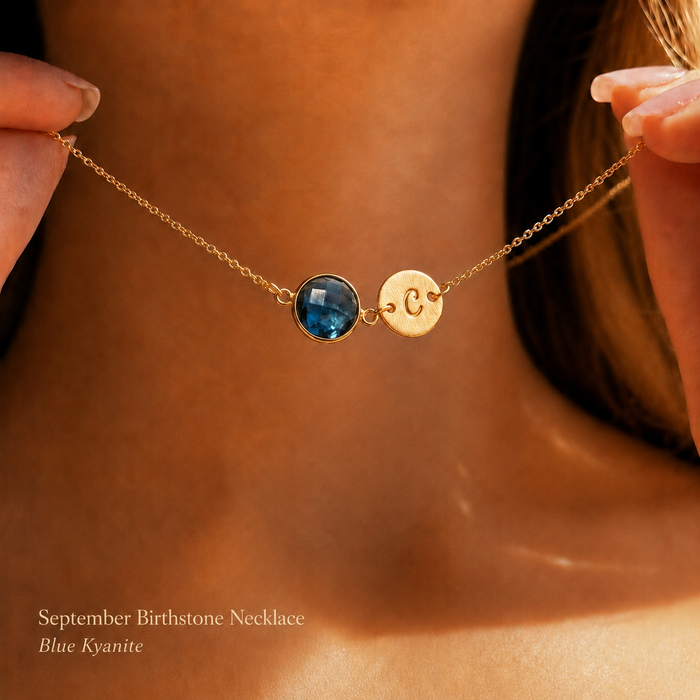Blue kyanite September birthstone necklace with engraved initial disc charm worn on model