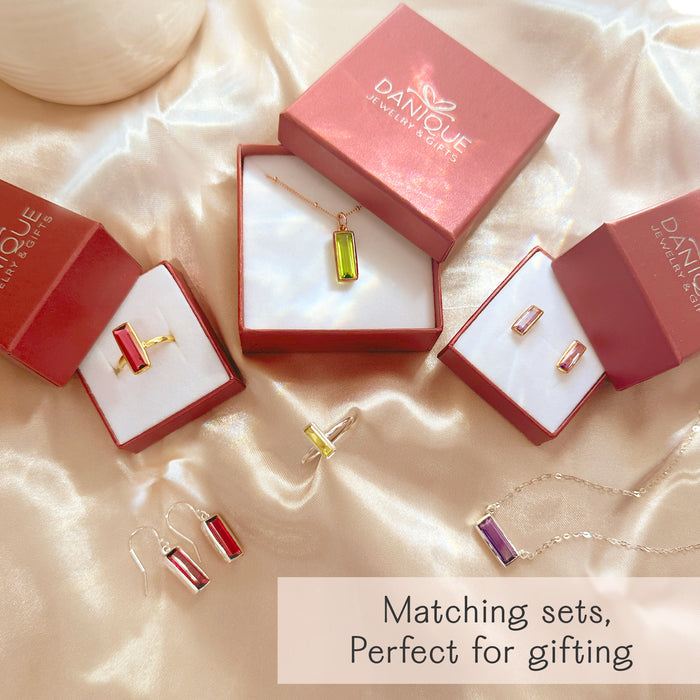 Gift-ready baguette birthstone bar necklace packaged in the Danique Jewelry box, perfect for Mother’s Day or Christmas. Personalize with engraved names, initials, or dates and choose stones by month—Aquamarine, Emerald, Sapphire, Opal, Peridot, Garnet, Ruby, Citrine, Blue Topaz, and more. A keepsake birthstone mom necklace she’ll treasure; handmade in sterling silver, gold filled, or rose gold.