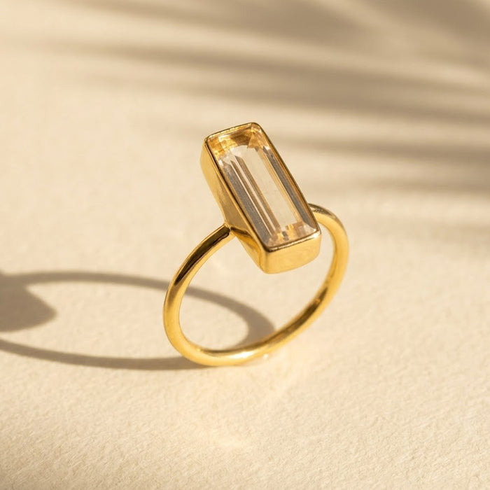 Clear quartz bar ring in gold vermeil, faceted rectangle April birthstone stacking ring