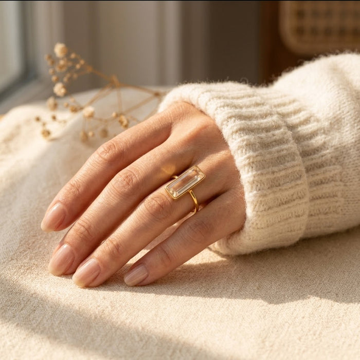 Model wearing colorful bar rings including clear quartz, stacking gemstone ring set
