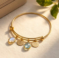 Custom birthstone bangle bracelet with teardrop birthstone charms and initial discs, personalized family bracelet for mom or grandma.