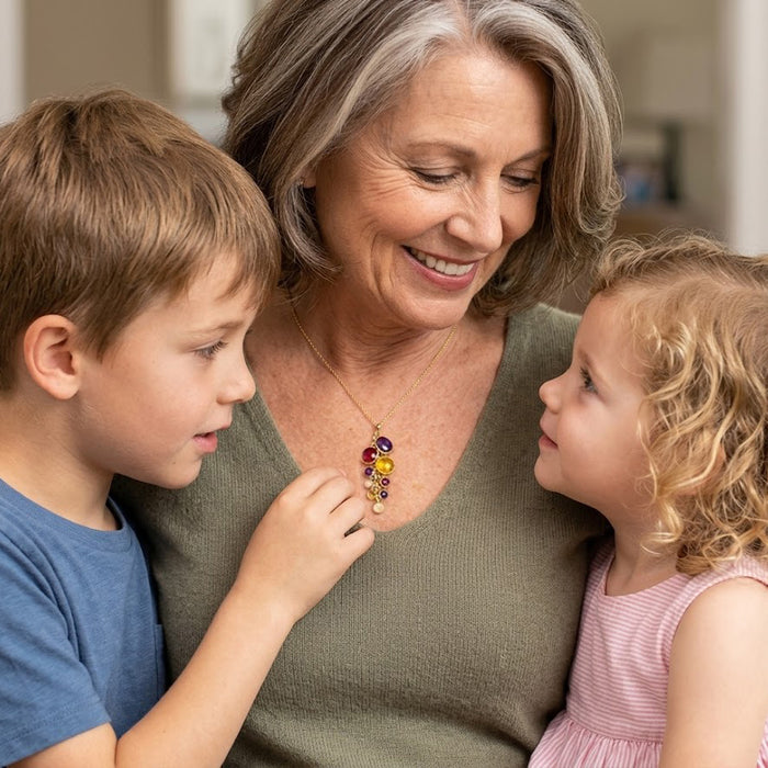 Grandmother wearing personalized birthstone necklace with grandchildren, a meaningful family keepsake necklace.