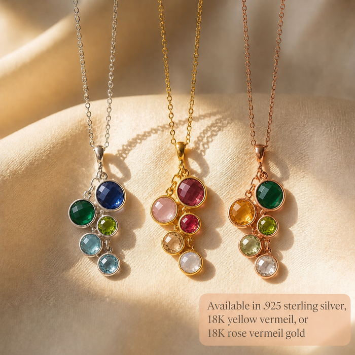 Gold, sterling silver, and rose gold custom birthstone necklaces with colorful round gemstones for family jewelry.