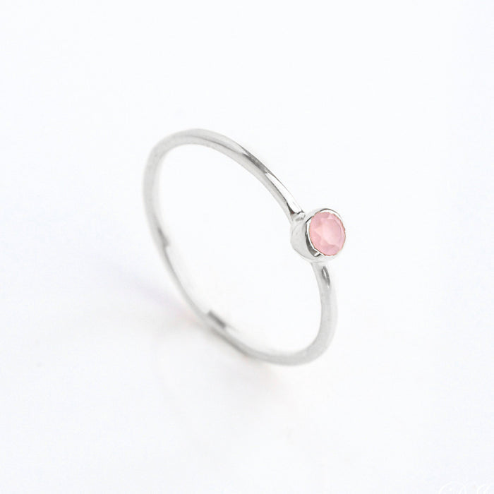 sterling silver dainty 3mm pink chalcedony gemstone ring. October  birthstone. On white background. 925 sterling silver, birthstone ring, stacking ring, stackable, birthstone jewelry, facet gemstone
