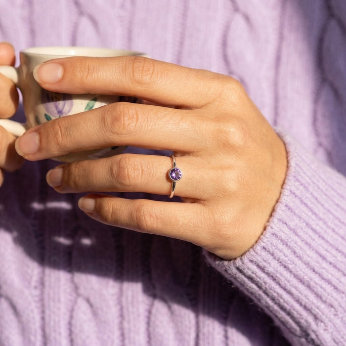 Tiny amethyst ring on hand lifestyle shot, minimalist February birthstone ring gift for her