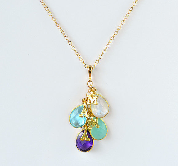 Gold filled cascade teardrop birthstone necklace with moonstone, blue topaz, aqua chalcedony and purple amethyst birthstones and plain letter initial charms. birthstone jewelry.