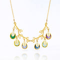 Tree branch necklace in gold filled with full engraved names on oval tags and prong set green onyx, green amethyst, alexandrite, kyanite, blue topaz or purple amethyst birthstones.