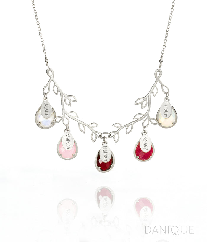 Tree branch necklace in silver with engraved full name tags and moonstone, pink chalcedony, garnet, ruby and opalite birthstones.