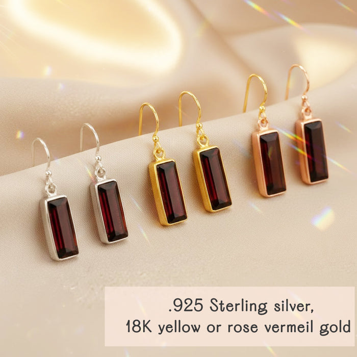 Garnet baguette earrings displayed in multiple metal finishes, including sterling silver and gold vermeil. Rectangular garnet gemstone earrings designed as minimalist birthstone jewelry. January birthstone drop earrings crafted for everyday wear, layering with other jewelry, or meaningful gemstone gifting.