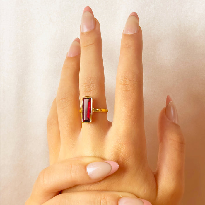 Gold Garnet Quartz baguette ring shown on hand for scale