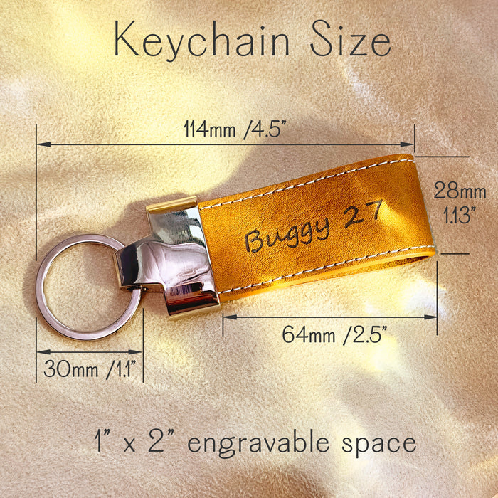 Yellow leather keychain with engraved name “Buggy 27,” shown with precise measurements including total length 4.5", key ring diameter 1.1", and engravable area of 1" x 2". Features include stitched edges and polished metal hardware. Great for custom text, gamer tags, initials, or team names. Compact and durable design ideal for backpacks, luggage, gym bags, or school keys. Personalized key tag for sports teams, kids’ gifts, daily use, or small business branding. Makes a vibrant, functional accessory.