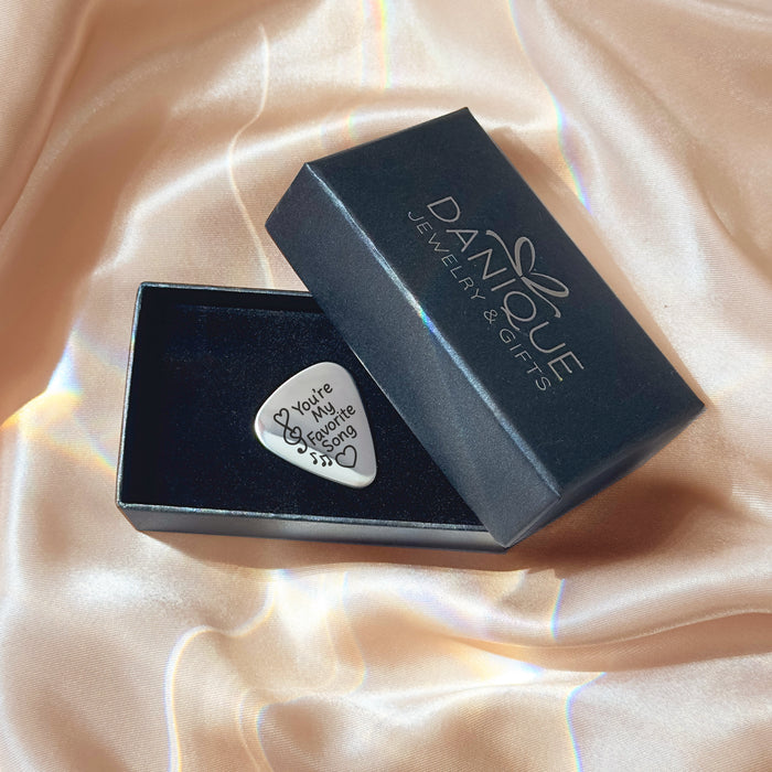 Gift-ready presentation of custom engraved guitar pick in Danique Jewelry box, perfect for Father’s Day, Christmas, weddings, or groomsmen gifts.