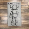 Brand new Kaws Companion figure standing on white background
