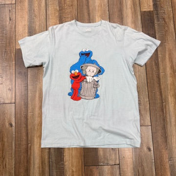 KAWS x Uniqlo x Sesame Street Companion Trash Can Tee Light Blue
