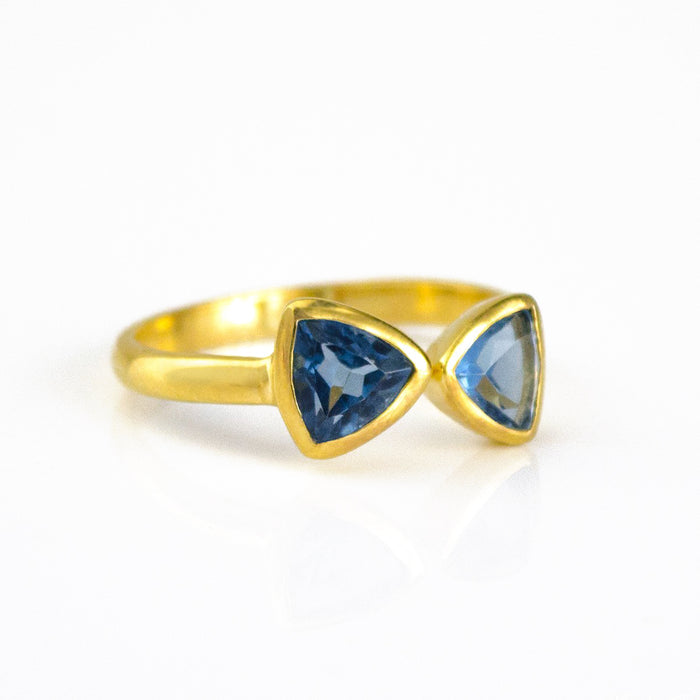 A gold kyanite ring. Adjustable Kyanite Quartz triangle ring, Kyanite bow tie ring, personalized Kyanite jewelry, sterling silver Kyanite triangle ring, gold Kyanite ring, rose gold Kyanite Quartz ring, unique blue Kyanite, September birthstone jewelry, triangle-cut Kyanite Quartz, custom gemstone ring, chic Kyanite jewelry, bespoke blue gemstone ring, Kyanite stacking ring, elegant triangle ring, trendy Kyanite accessory, custom Kyanite gift, adjustable bow tie ring, unique Kyanite jewelry, blue Kyanite