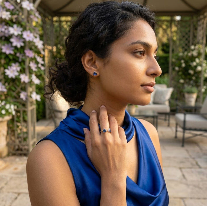 Woman wearing blue kyanite stud earrings gold dainty everyday jewelry