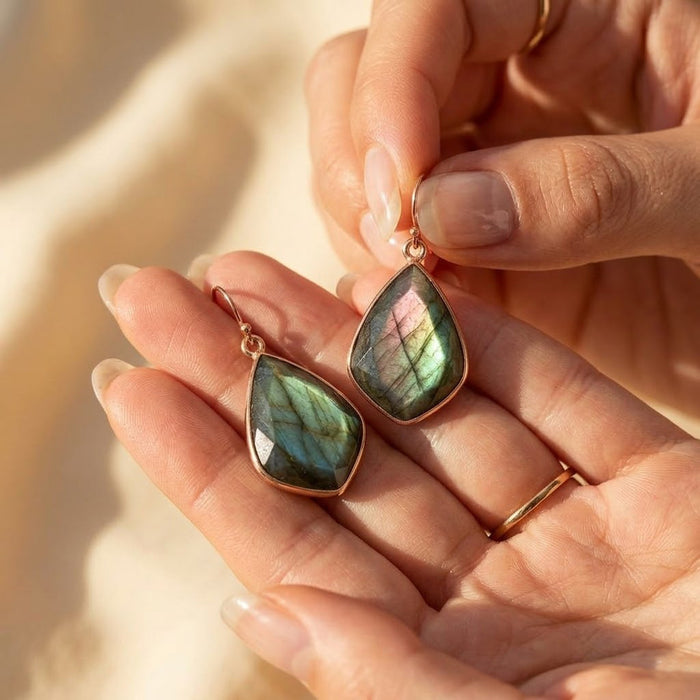 Blue labradorite gemstone earrings dainty drop earrings for women in close up shot