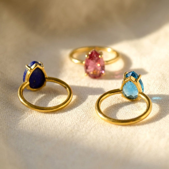 Teardrop stone birthstone chart for custom gemstone rings, showing monthly birthstone options for personalized ring gifts.