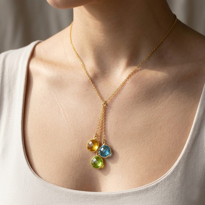 Woman wearing birthstone lariat necklace, dainty gold Y necklace with colorful gemstones