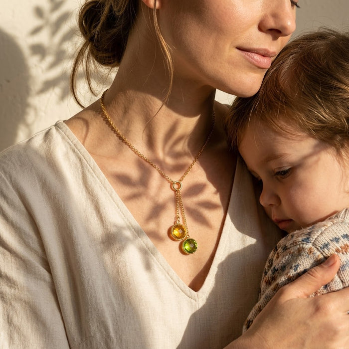 Mother and child wearing birthstone necklace, meaningful family jewelry gift for mom