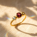 Custom mom birthstone ring with three stones, center stone for mother and two side stones for children