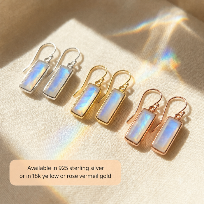 Moonstone bar earrings in sterling silver, yellow gold, and rose gold with text explaining available metal finishes.