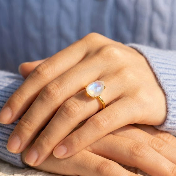 Moonstone ring worn on hand with size guide text for US sizes 5 to 9
