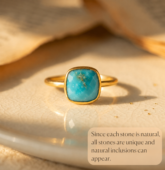 Natural turquoise ring with note about unique inclusions and natural stone variation.