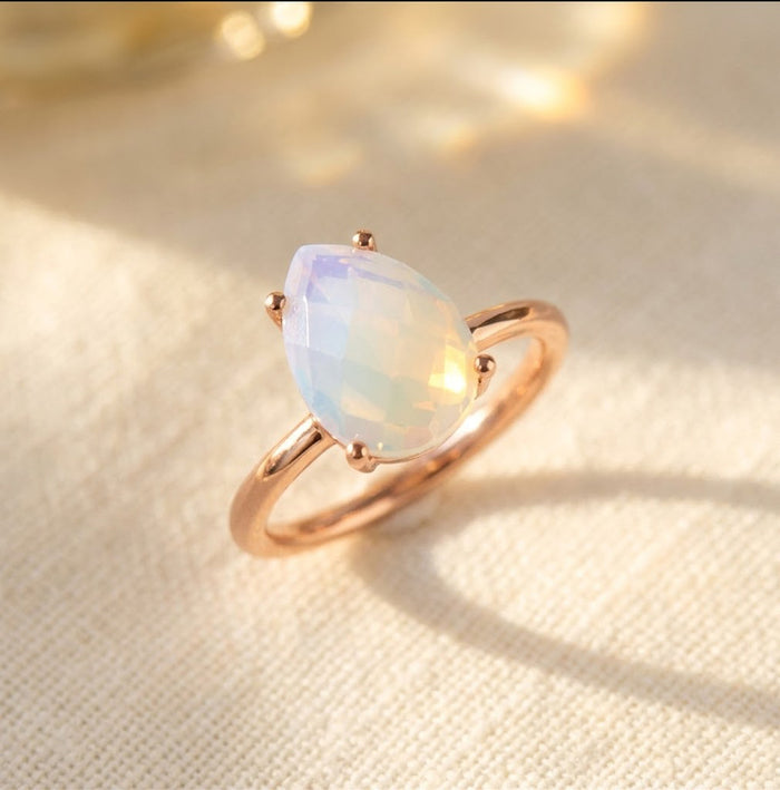 Opalite teardrop prong ring in rose gold vermeil, an October birthstone ring with a soft iridescent pear gemstone for a birthday gift or stacking ring.