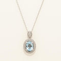 Oval Blue Topaz Necklace in Sterling Silver with Diamonds (1/20ct tw)
