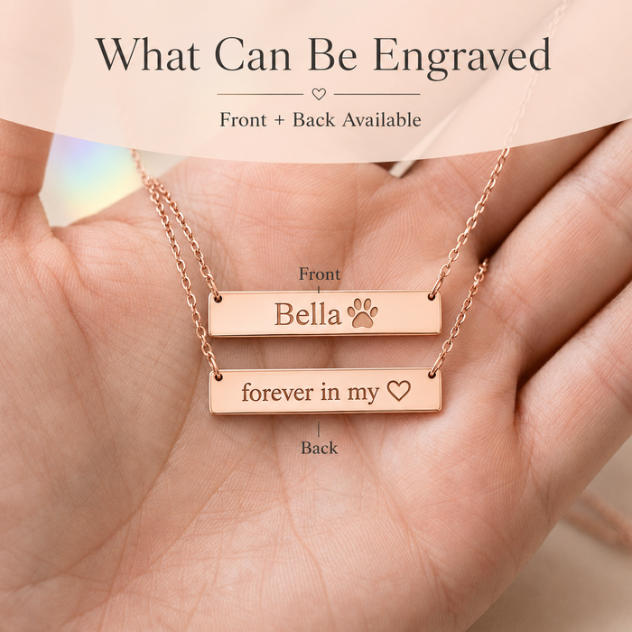 Front and back engraving example for paw print bar necklace with pet name Bella and short memorial message.