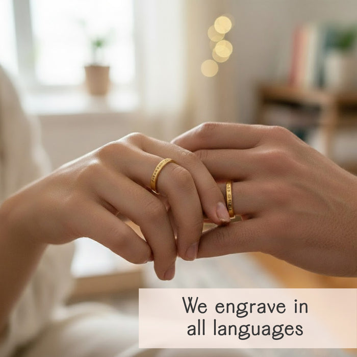 Personalized ring showing engraving in multiple languages for meaningful custom jewelry.