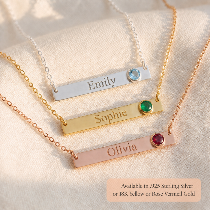 Three custom engraved bar necklaces in silver, gold, and rose gold with birthstone accents.