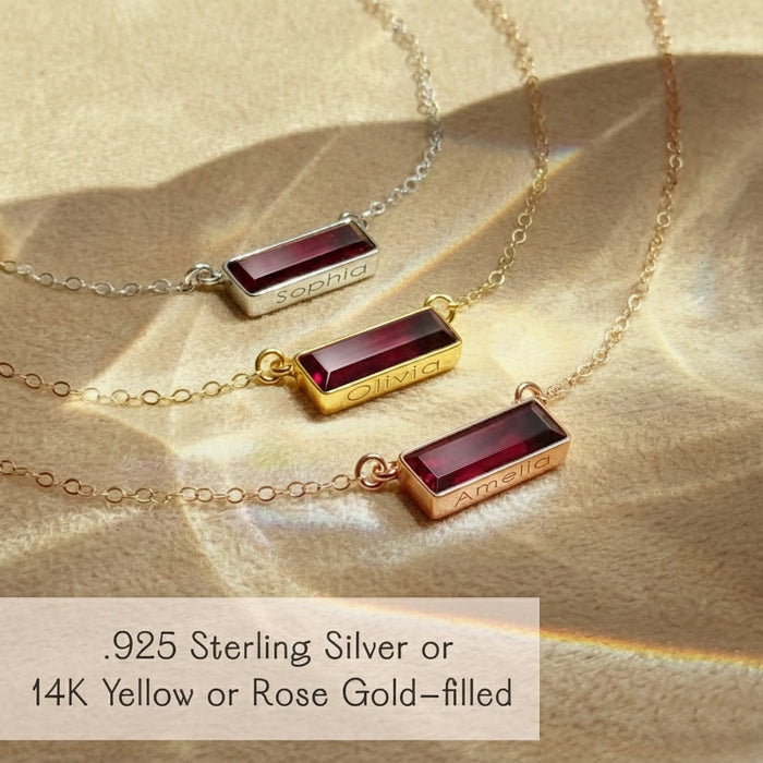 Custom engraved garnet necklace with secret message detail, showing engraving on top and bottom of baguette bar pendant, unique personalized jewelry keepsake