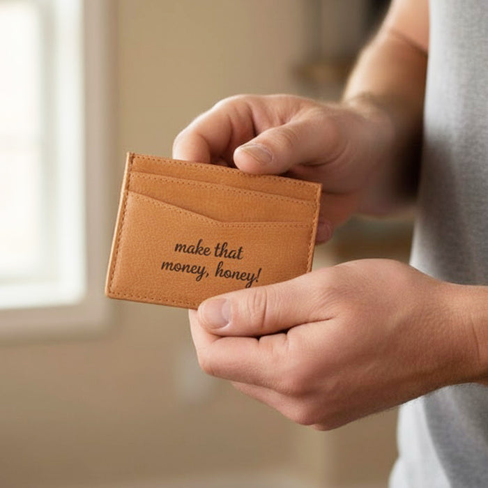 Handcrafted engraved leather card holder shown in hand, custom message wallet for men, slim personalized wallet, great gift for boyfriend, husband, Christmas or Father’s Day.