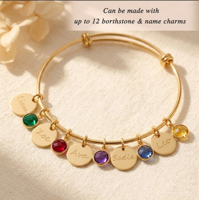 personalized bangle bracelet worn on wrist with engraved charms and birthstones, elegant custom jewelry for women