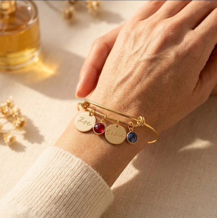 birthstone charm bracelet guide showing gemstone options, custom engraved bracelet personalization for mom or grandma