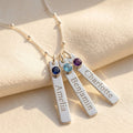 Personalized name bar birthstone necklace with engraved charms and blue gemstones in sterling silver