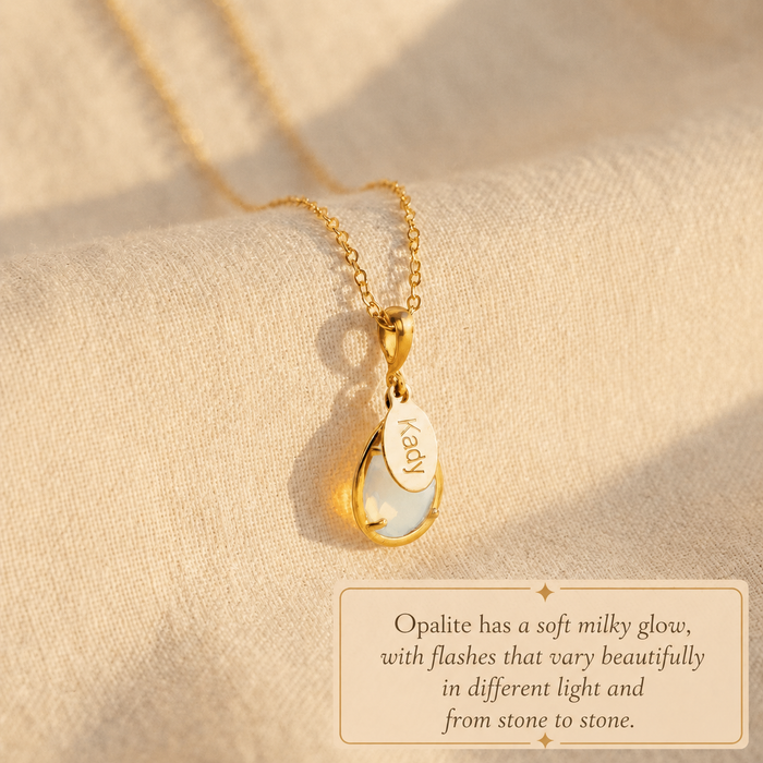 Personalized opalite birthstone necklace displayed in warm natural sunlight.