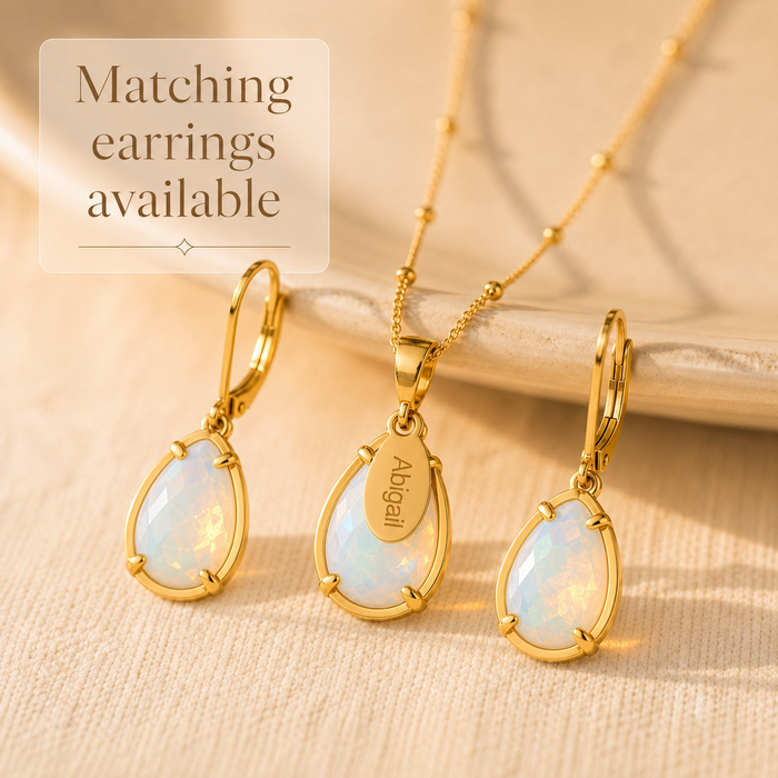 Personalized opalite birthstone necklace and matching earrings displayed in warm natural sunlight.