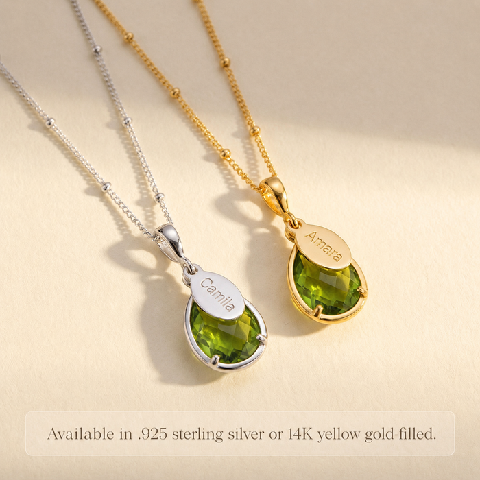 Personalized peridot necklace available in sterling silver or 14K yellow gold-filled, shown with green teardrop birthstone pendant and engraved name charm.