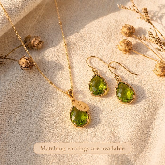 Gold peridot necklace with matching earrings, personalized August birthstone jewelry set with engraved name charm and green teardrop gemstone.